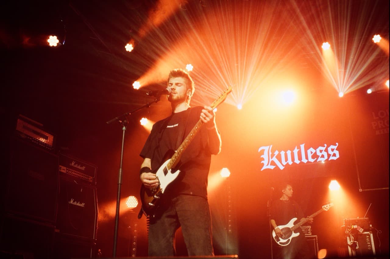 Caden Chambers performing live on stage with Kutless